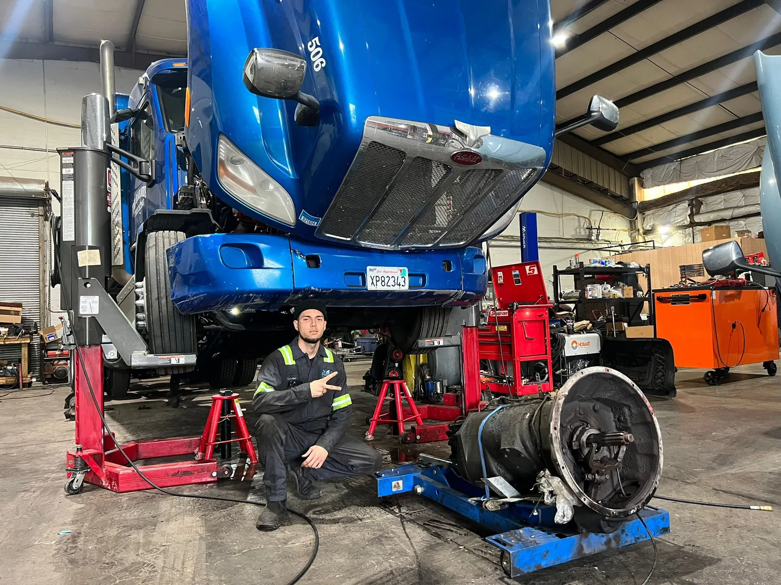 Blue Peterbilt raised on the lift with rear end pulled at the Diesel HP Solutions shop